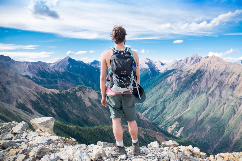 A person hiking through a mountainous landscape.