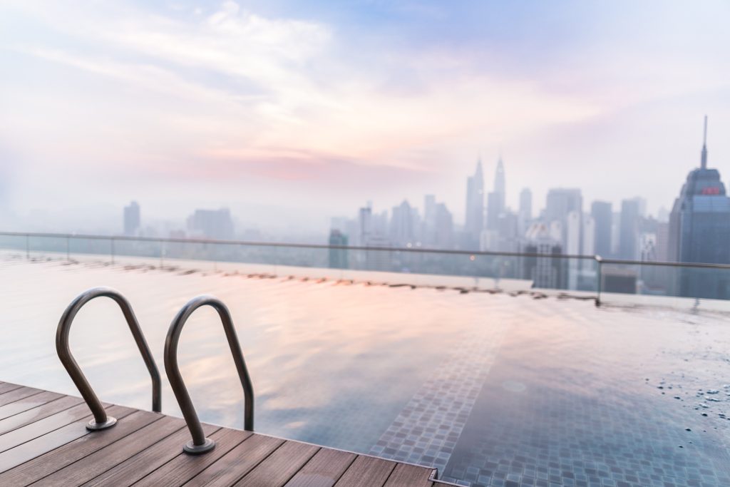 A body of water stretches out to a city skyline.