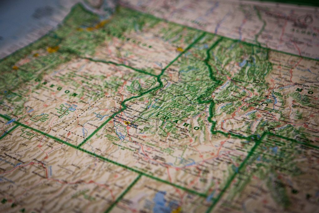 Close-up view of a detailed topographic map highlighting geographic features and boundaries of US states.